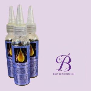 Three dropper bottles with blue labels on a lavender background; Bath Bomb Beauties logo appears in the bottom-right.
