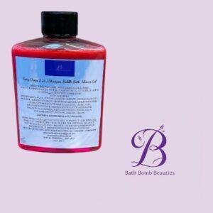 Red bottle of bath product with a blue label, placed beside a purple Bath Bomb Beauties logo on a pale pink background.