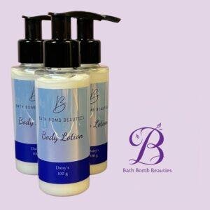 Three bath bomb beauties body lotion bottles with pump tops on a lavender background