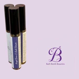 Three lip balm tubes with black caps on a lavender background beside Bath Bomb Beauties logo.