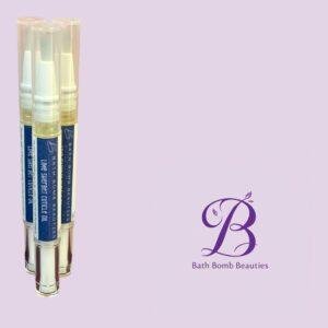 Three clear spray bottles with blue labels and white caps stand upright on a lavender background, part of Bath Bomb Beauties cosmetics.