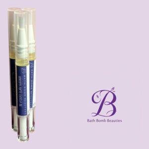 Three clear pump bottles containing light yellow liquid on a lavender background with Bath Bomb Beauties branding visible in the corner.