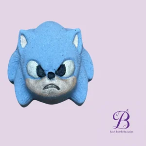 Blue Sonic-inspired bath bomb with an angry face on a light purple background; Bath Bomb Beauties logo in the corner.