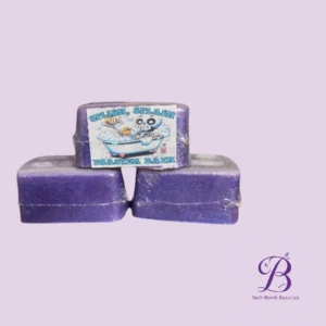 Three purple bath bombs stacked, with a label that reads 'Splish, Splash Toaster Bath' and a Bath Bomb Beauties logo in the corner.