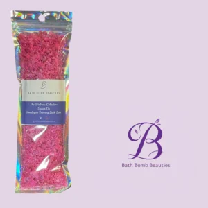 Holographic bag of pink himalayan foaming bath salts by bath bomb beauties on a lavender background with logo