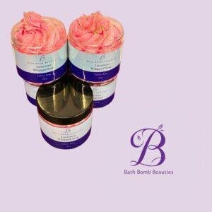Two pink whipped soap jars labeled Bath Bomb Beauties Luxurious Whipped Soap Fakher Rose on a lavender background.