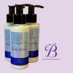 Three pump-bottle containers labeled Bath Bomb Beauties Body Lotion, with black pumps, arranged in front of a pale purple background and a purple BB logo