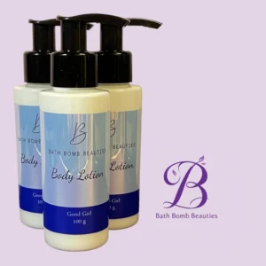 Row of Bath Bomb Beauties body lotion bottles with black pumps, labeled 'Body Lotion' against a pale purple background.