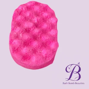 Bright pink, round bath bomb with a bumpy surface on a light lavender background; Bath Bomb Beauties logo in the lower-right corner.
