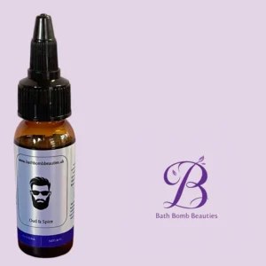 Amber glass dropper bottle labeled Oud & Spice from Bath Bomb Beauties against a pink background