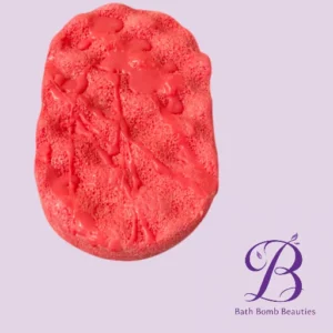 Pink bath bomb with a textured surface on a light lavender background bath bomb beauties logo in purple in the lower right