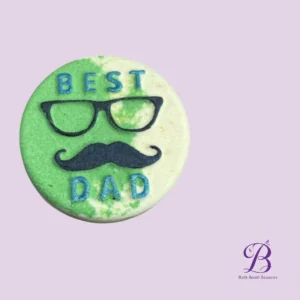 Round green and white bath bomb with best dad text and a glasses and mustache design