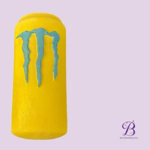 Bright yellow bath bomb with turquoise blue drips on a lavender background; Bath Bomb Beauties logo in the corner.