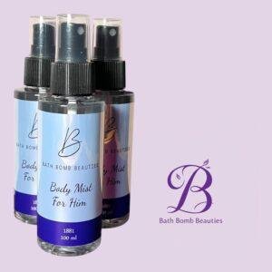 Three spray bottles labeled 'Body Mist For Him' from Bath Bomb Beauties against a lavender background with the brand's purple logo visible.