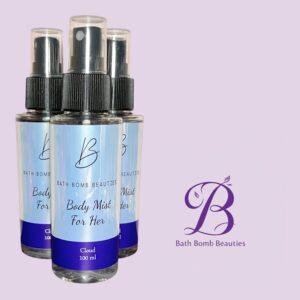 Three bath bomb beauties body mist spray bottles with black caps set against a lavender background