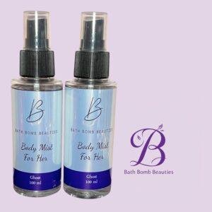 Two bath bomb beauties body mists for her ghost scent  ml standing side by side on a light purple background with a purple logo in the corner