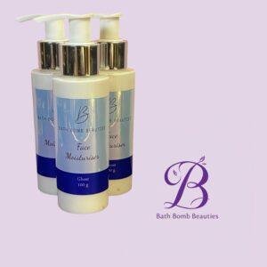 Three bath bomb beauties facial moisturiser pump bottles on a lavender background with the brand logo visible in the corner
