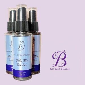 Three bath bomb beauties body mist for her spray bottles on a pastel purple background with the brands purple logo visible at right