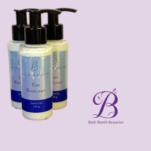 Three pump top bottles labeled face moisturiser from bath bomb beauties on a lavender background with the brand logo in the corner