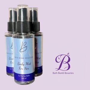 Three spray bottles labeled bath bomb beauties body mist for her on a lavender background with logo in frame
