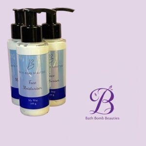 Three blue-and-white pump bottles labeled 'Bath Bomb Beauties Face Moisturiser' on a light purple background with a purple Bath Bomb Beauties logo in the corner