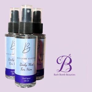 Three bath bomb beauties body mist spray bottles oud spice for him displayed against a light purple background with branding