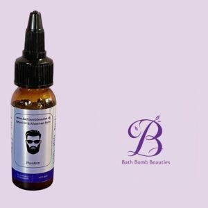 Beard oil bottle labeled phantom by bath bomb beauties on a purple backdrop