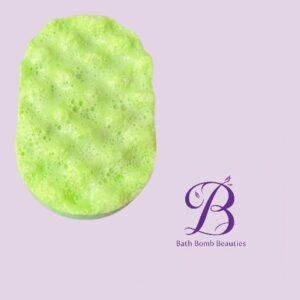Green bubbly bath bomb on a pale lavender background, with the Bath Bomb Beauties logo in purple on the right.