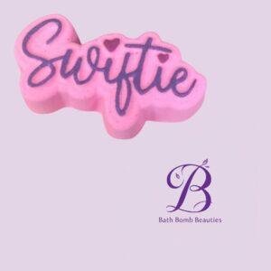 Pink soap bar with 'Sweetie' written in dark purple cursive; Bath Bomb Beauties logo visible in the bottom-right corner.