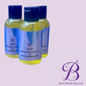 Two yellow liquid bottles with blue labels and dark blue caps, placed on lavender background with Bath Bomb Beauties logo in the bottom right corner.