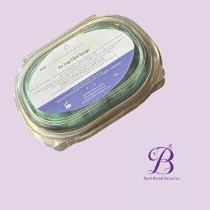 Glass jar with a labeled bath product on a lavender background; branding reads Bath Bomb Beauties (logo and product label visible).