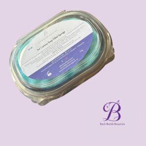 Close-up of a labeled jar on a lavender background, showing Bath Bomb Beauties branding.