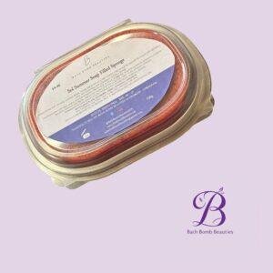 Close-up of a Bath Bomb Beauties jar label on a lavender background, showing the brand name and product text.