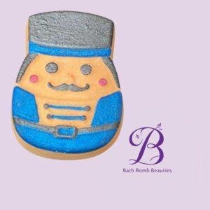 Smiling cartoon police officer cookie in a blue uniform with hat on a light purple background.