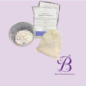 Bath Bomb Beauties product layout: mixing bowl with bath salts, two packaged blends, and a burlap sachet on a lavender background with logo nearby.