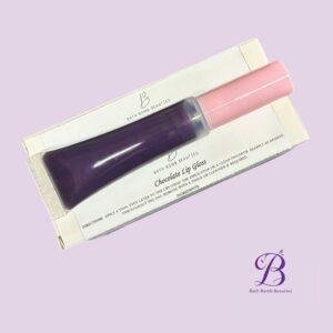 Chocolate lip gloss bath bomb beauties Chocolate lip gloss set from bath bomb beauties in a white box with clear window showing purple and pink tubes on a lavender background