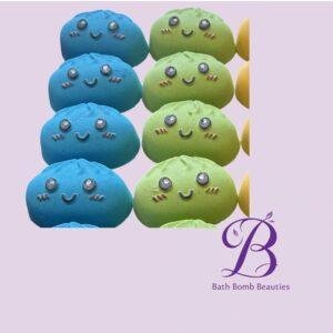 Rows of blue and lime macarons with happy faces on a pastel lavender background; Bath Bomb Beauties logo at bottom right.