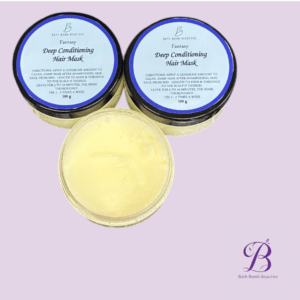 Two jars of Bath Bomb Beauties Deep Conditioning Hair Mask on a lavender background; one jar open showing pale yellow product, with two sealed jars beside it.