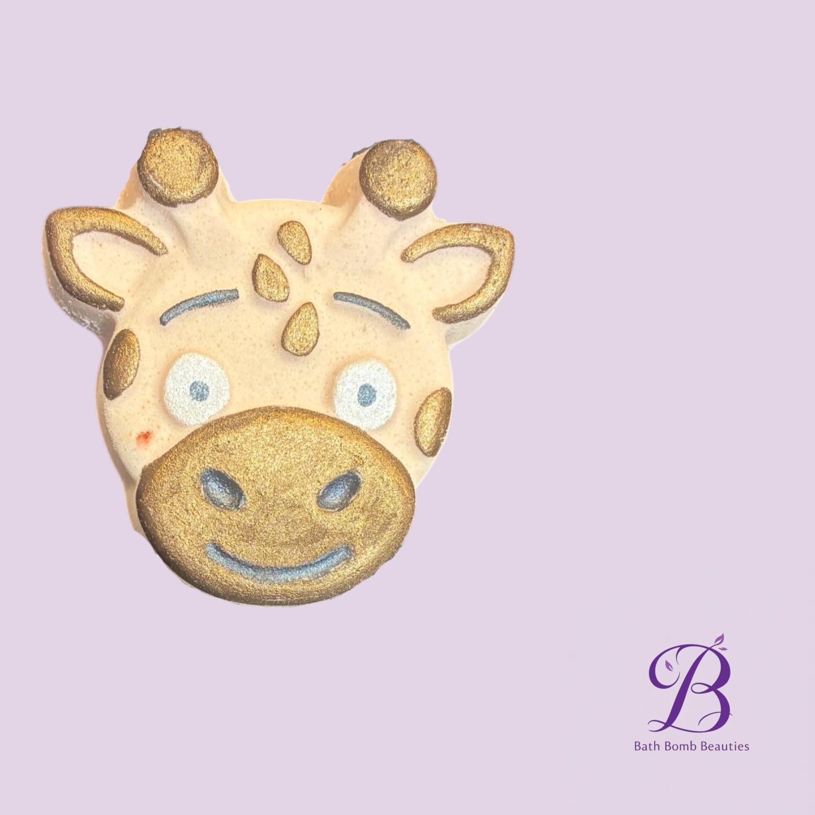 Jamaican me crazy giraffe bath bomb beauties Giraffe themed cookie with gold accents on a lavender background logo bottom right reading bath bomb beauties